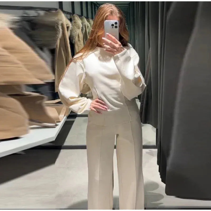 Women's polar fleece two-piece suit set showing long sleeve O-neck top with wide-leg trousers