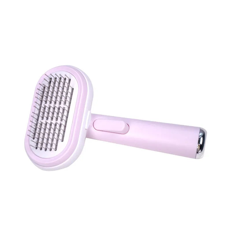 Blue and pink pet hair removal brush with steel needles on a light background