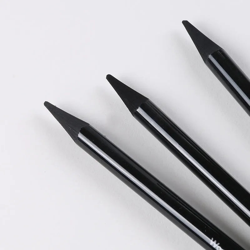 Graphite and carbonized drawing pencil set on a suction card, showing wooden-shell pencils.