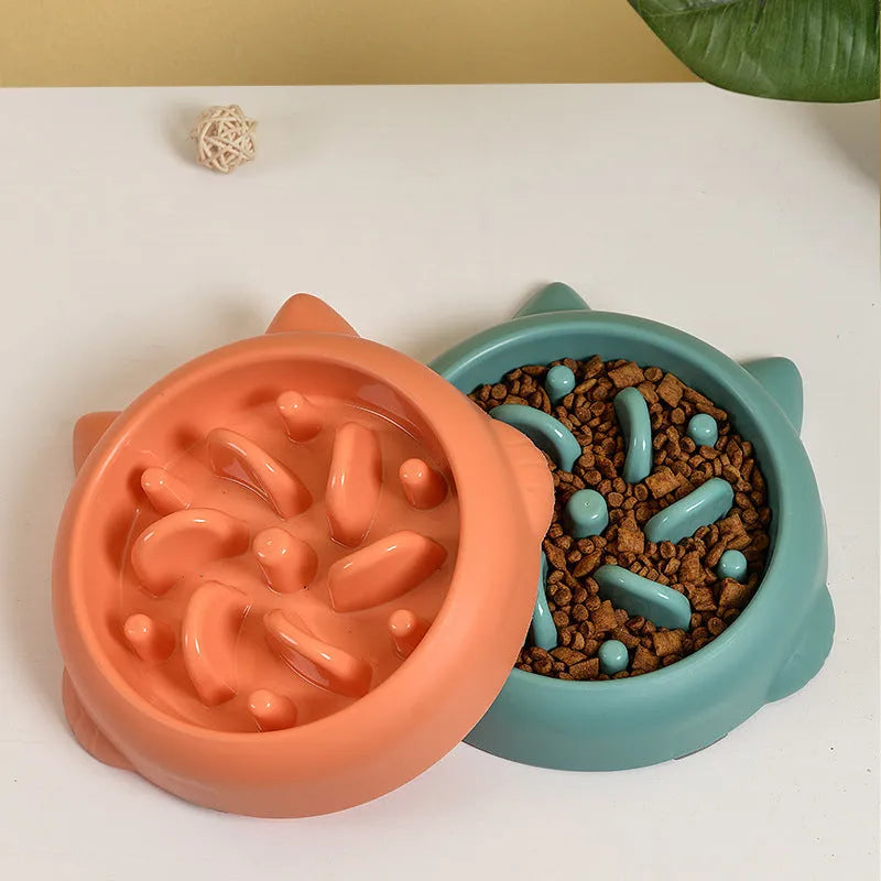 Green pet slow feeder bowl with raised internal maze design for dogs and cats