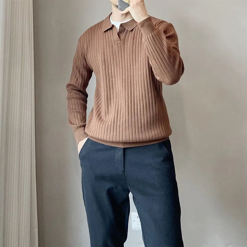 Man wearing a loose-fit Army Green knitted pullover sweater with long sleeves.
