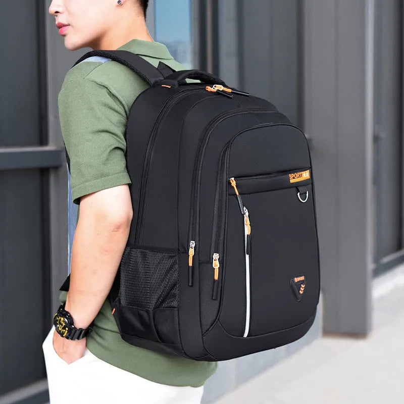 Men's Oxford cloth schoolbag showing air pillow belt system and 20-35 litre capacity