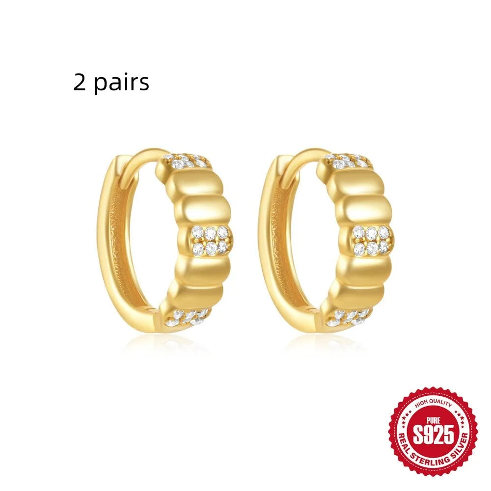 Sterling silver geometric stud earrings with small round diamond accents in gold or silver electroplated finish