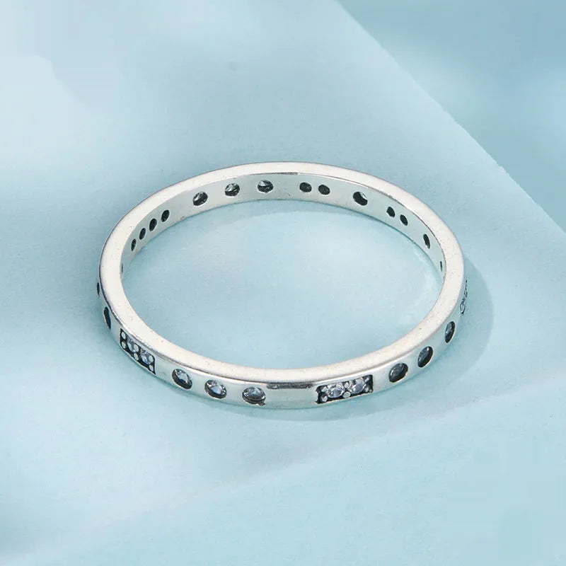 Silver I Love You password ring with oxidised black finish on a simple band, showing script engraving.