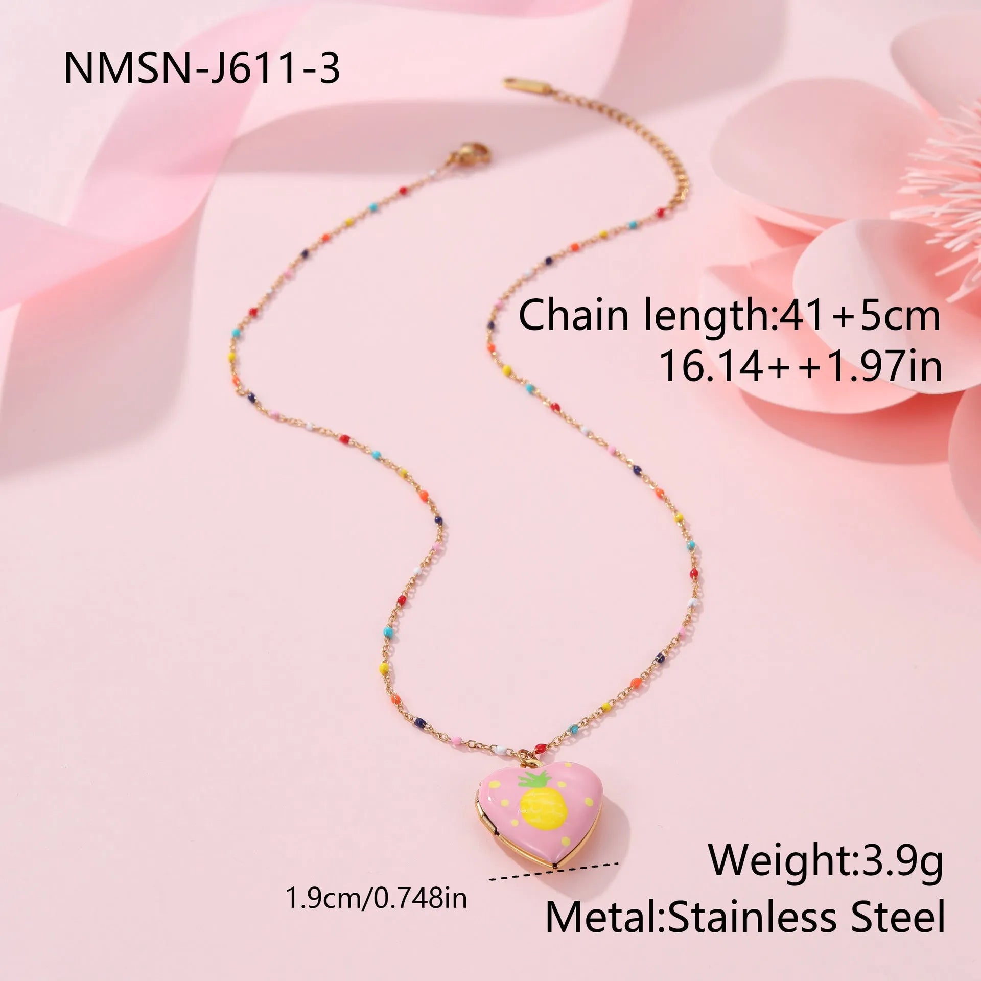 Gold-plated heart-shaped fruit pendant necklace on a stainless steel chain, showing grape design detail.