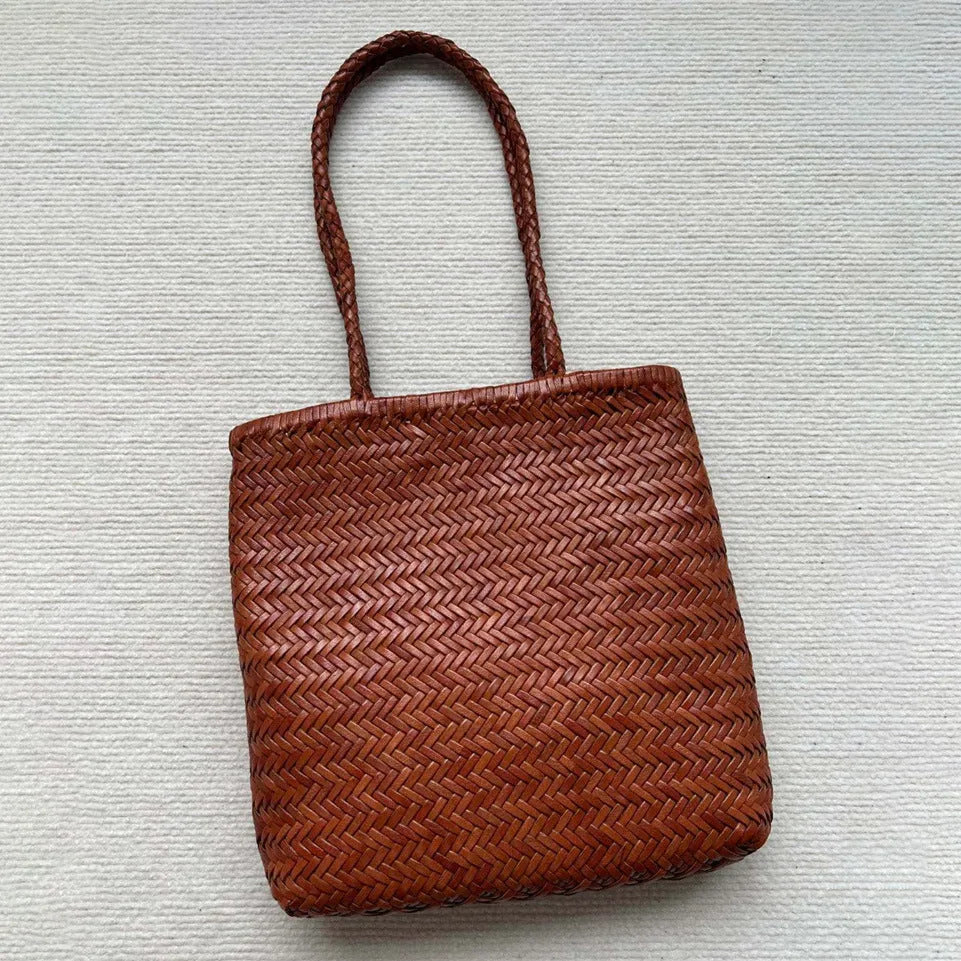 Brown handmade woven leather tote bag with outer pocket