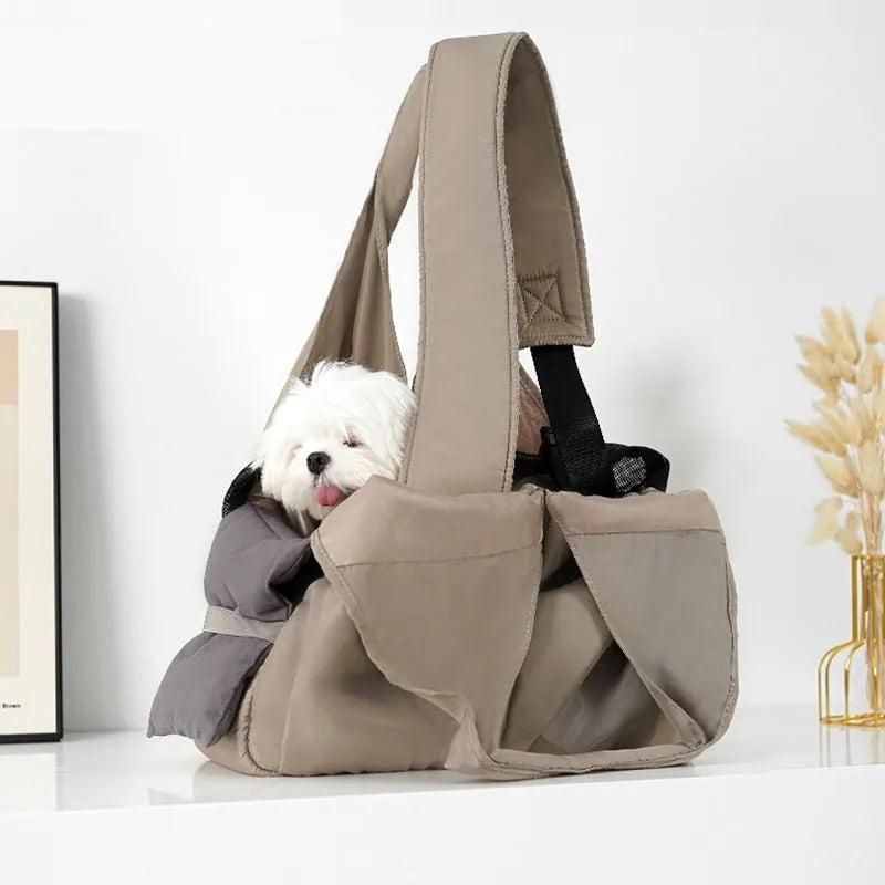 Apricot coloured cloth pet carrier handbag for small dogs or cats, showing carrying handles.