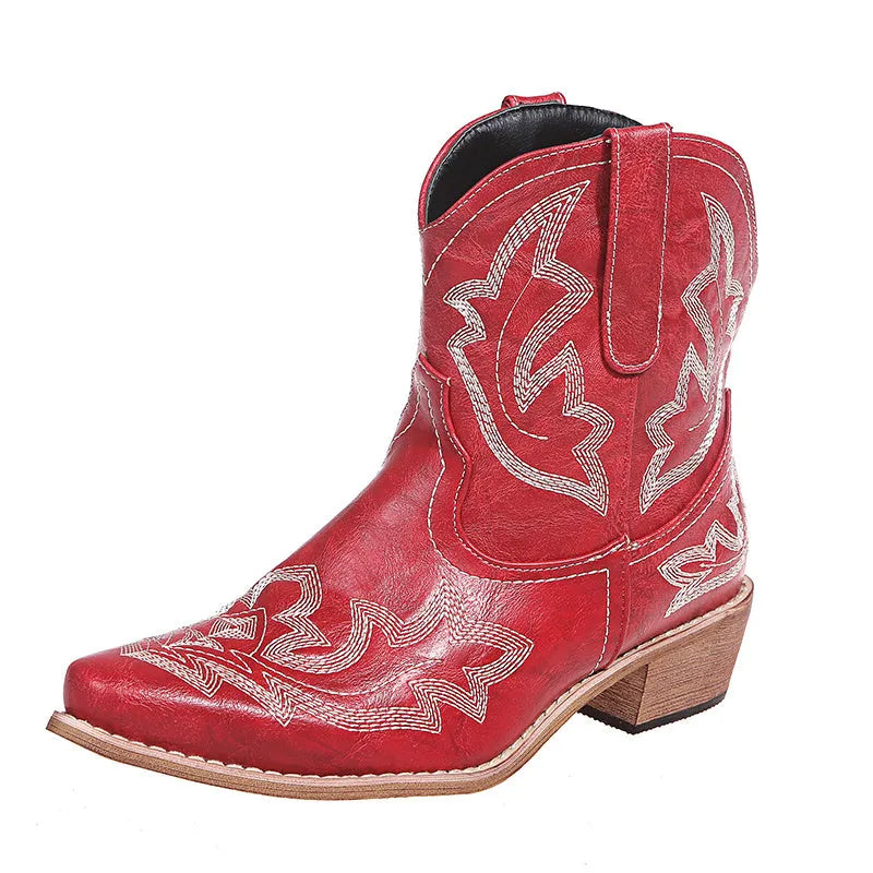 Blue women's cowboy boots with white embroidery, a low wedge heel, and a pointed toe