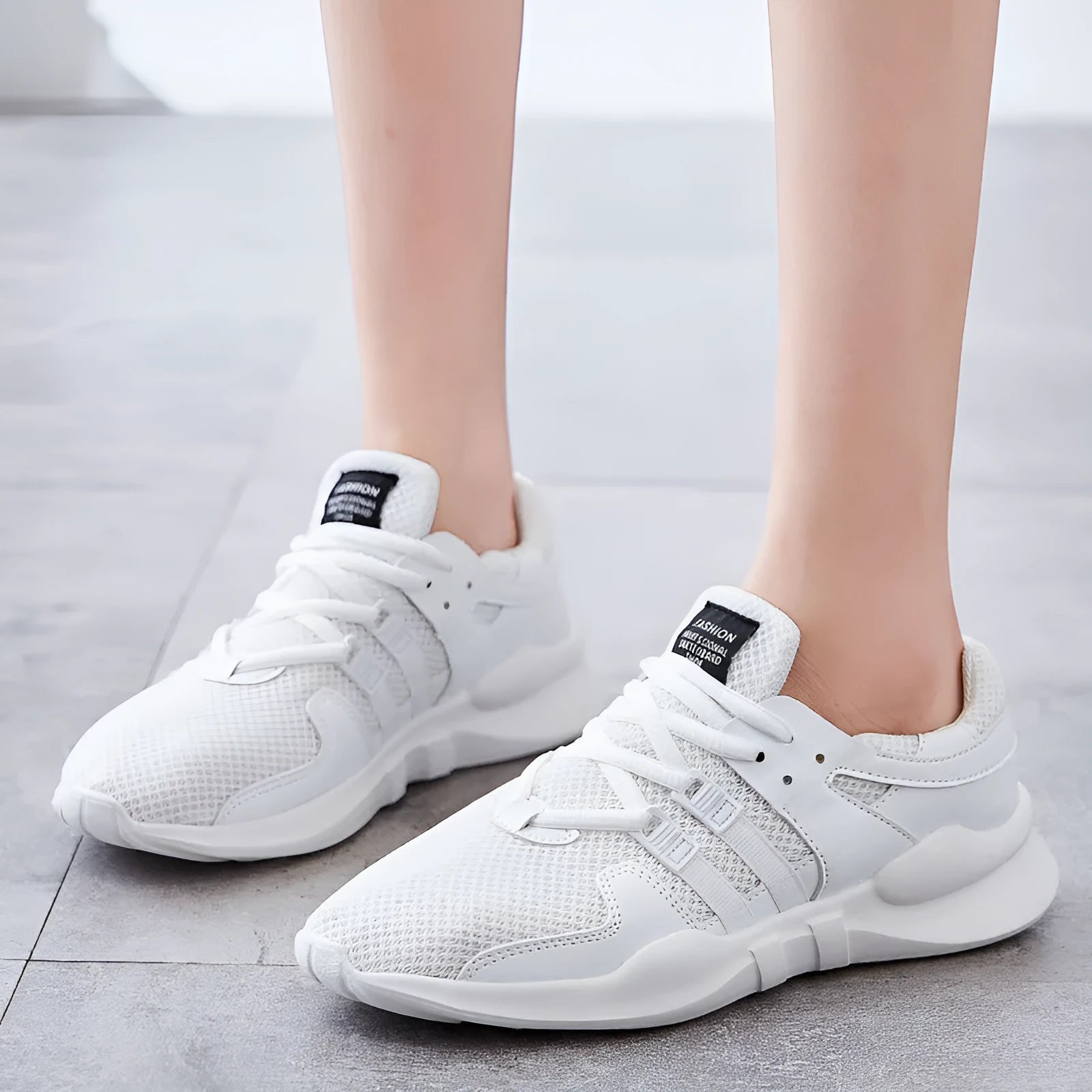 Breathable mesh sneaker with hollow-out design and a flat EVA sole, shown in a light colour on a neutral background.
