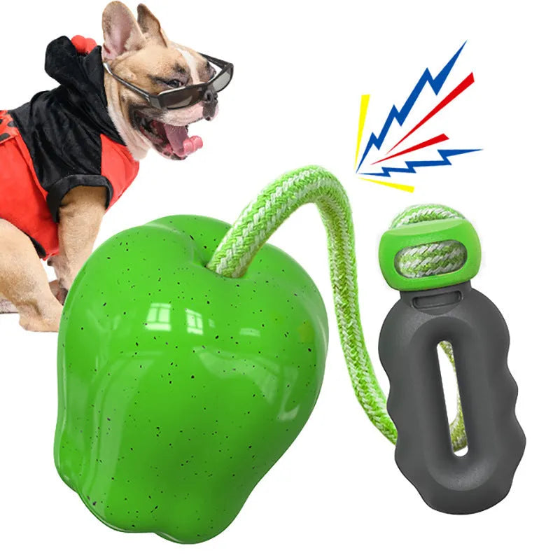 Green apple-shaped plastic dog chew toy with treat-dispensing opening