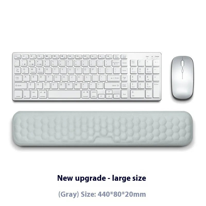 Memory foam mouse wrist rest pad with silicone base in black cloth cover option on desk