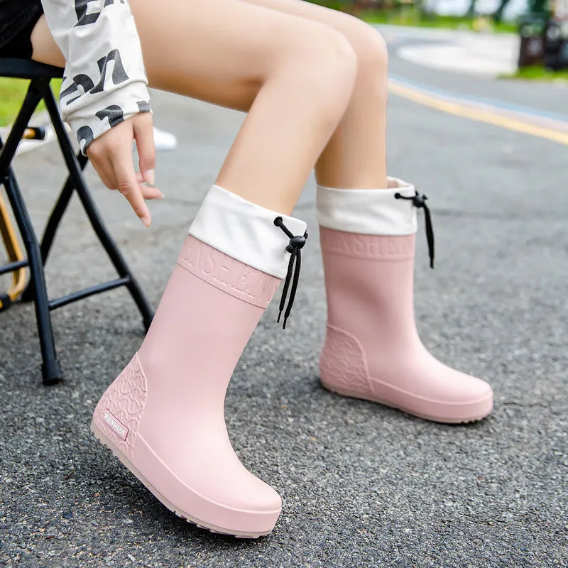 Women's PVC rain boots in apricot, black, brown and pink colours with non-slip wear-resistant construction