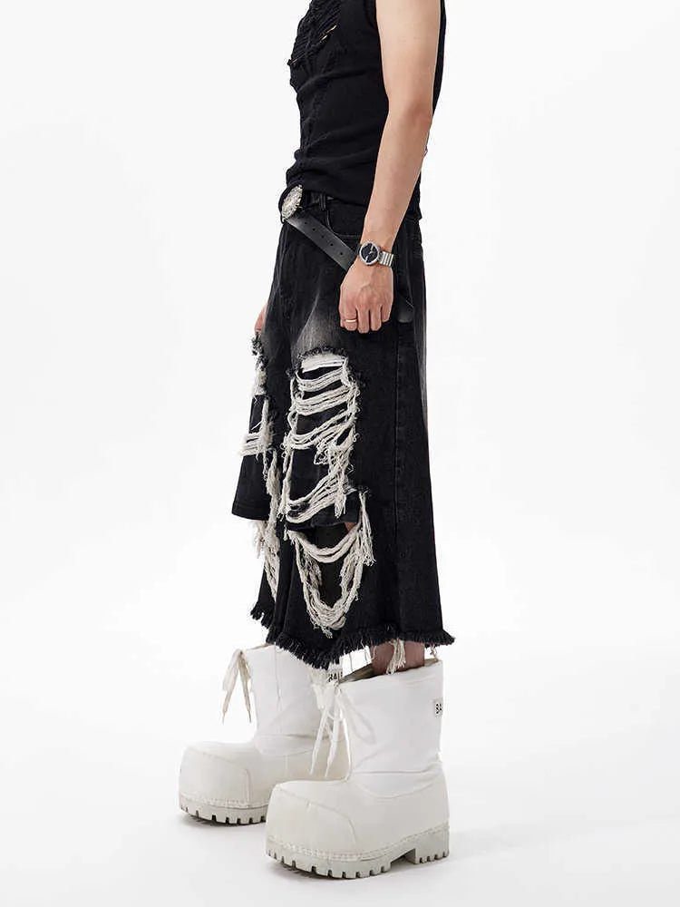 Black women's cropped wide leg jeans with mid-high waist and ripped patch detail