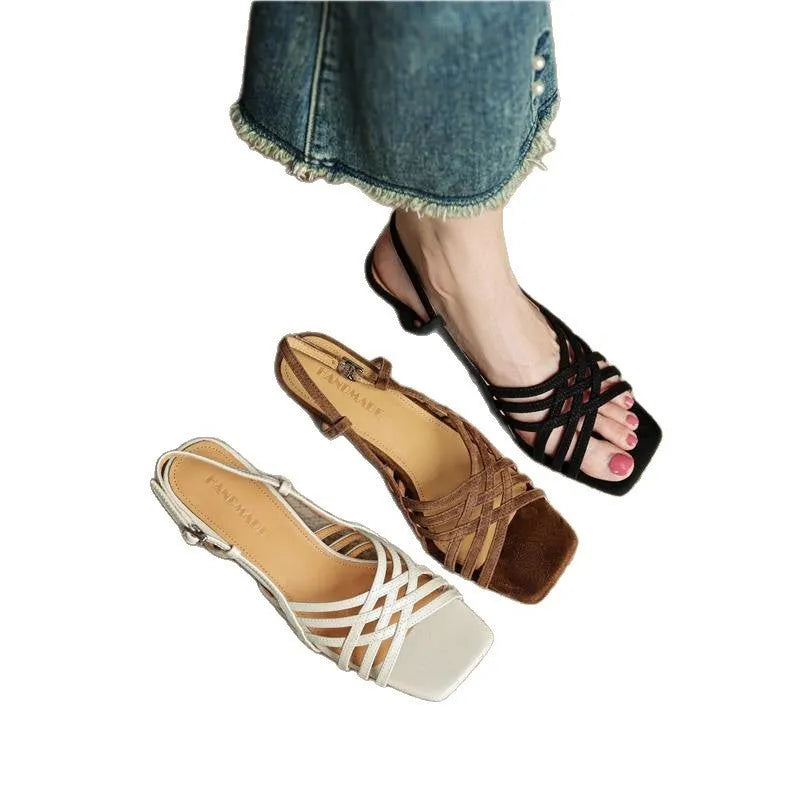 Light brown women's retro sandals with thin cross straps, ankle buckle, and a square toe on a mid heel.