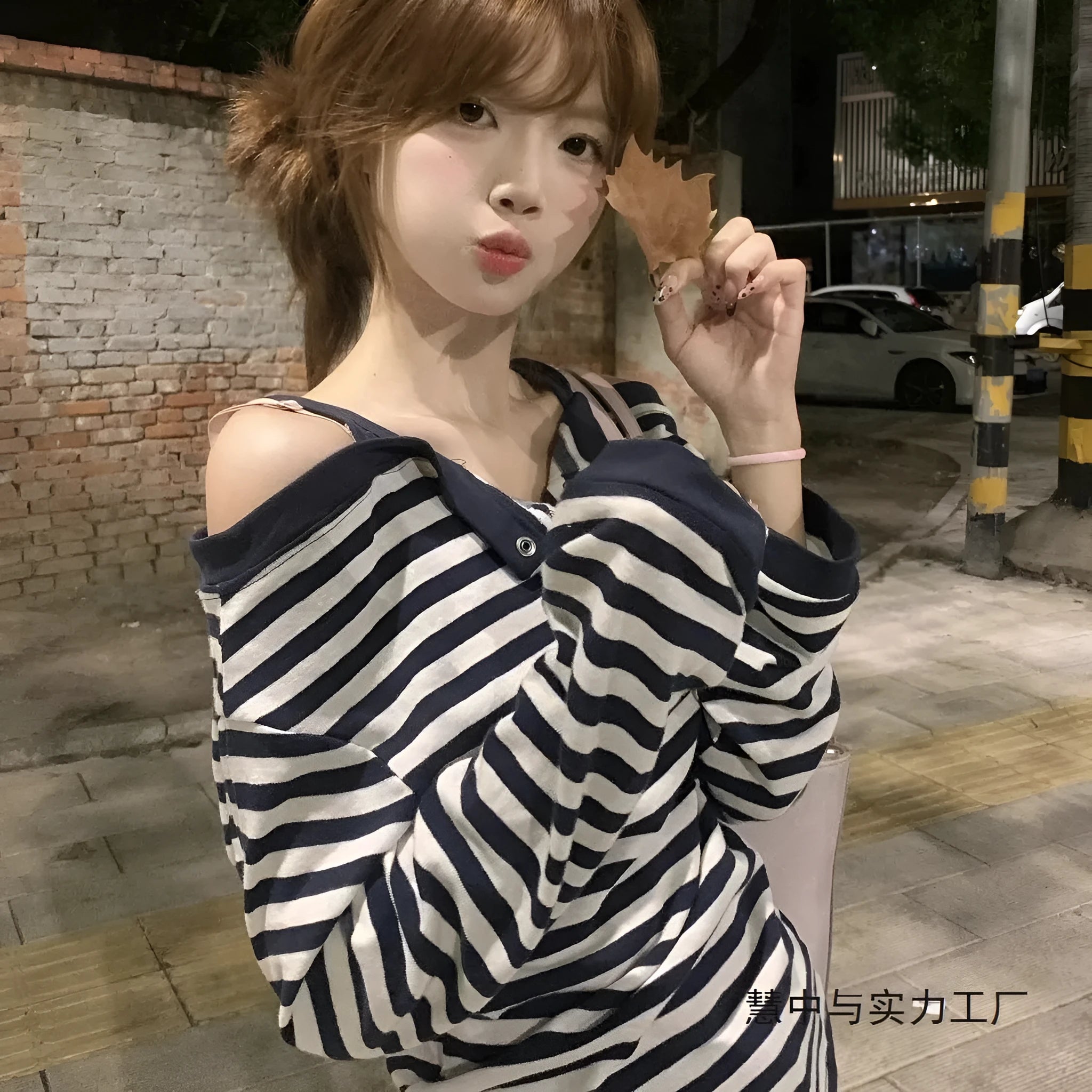Dark blue oversized women's T-shirt with embroidery, buttons, and striped details in Korean style