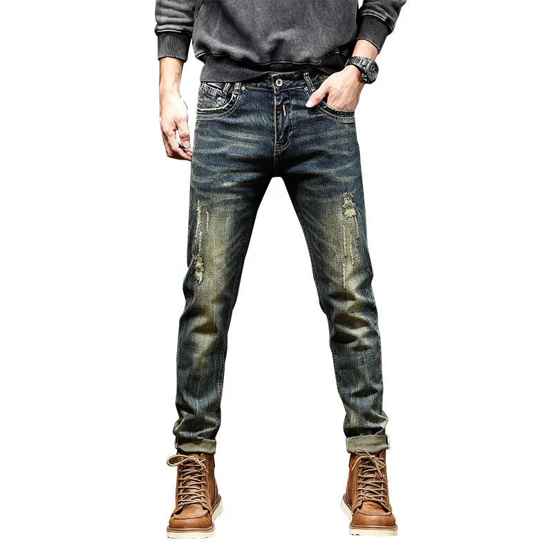 Men's skinny fit retro blue jeans with a zip fly on a grey background