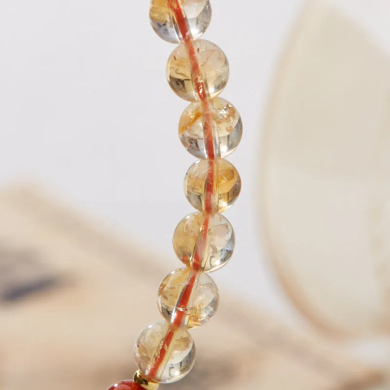 Hand-woven citrine five sutra bracelet with 6mm crystal beads on wrist