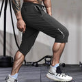 Men's cropped quick-dry sports casual pants in nylon, shown in blue colour.