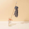 Brightly coloured furry octopus cat toy attached to a long stick for interactive indoor play