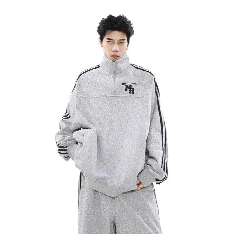 Black retro-style stand collar hoodie for couples on a mannequin, showing long sleeves and coat-style cut.