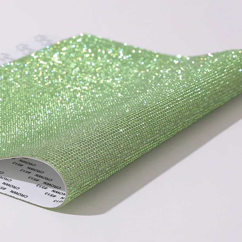 Rhinestone adhesive sheet with eight-eye pattern in multiple colour options on white background