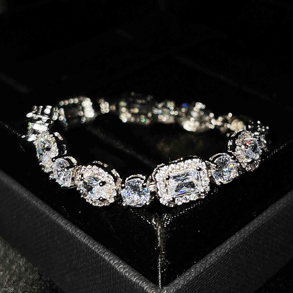 Women's white gold plated geometric bracelet with zircon stones in two length options.