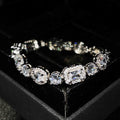 Women's white gold plated geometric bracelet with zircon stones in two length options.
