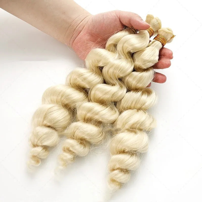 Golden synthetic hair weft wig showing length options on a stand.