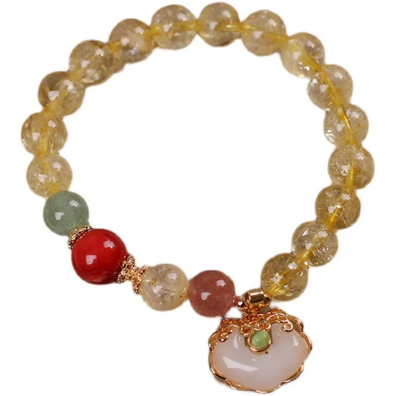 Women's bracelet with a yellow hair crystal jade ruyi pendant on an alloy chain.