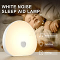 White rechargeable baby night feeding comforter sleeper unit with music function.