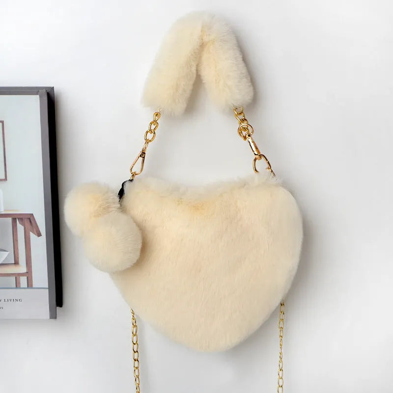 Heart-shaped women's plush handbag with soft texture and detachable shoulder strap in medium size