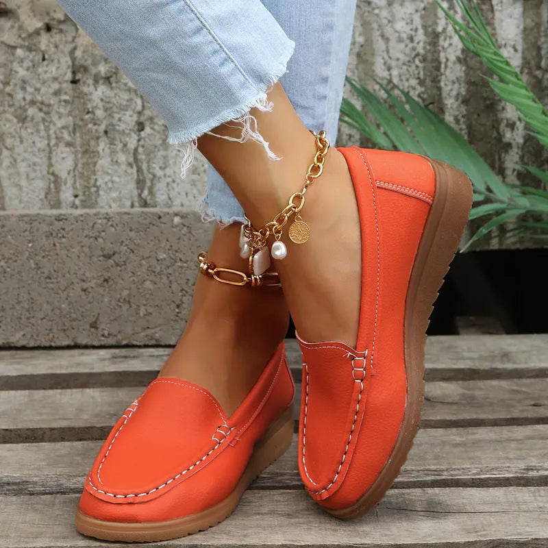 Women's flat loafer shoes in PU leather, showing round toe and car suture detail, on a rubber sole.