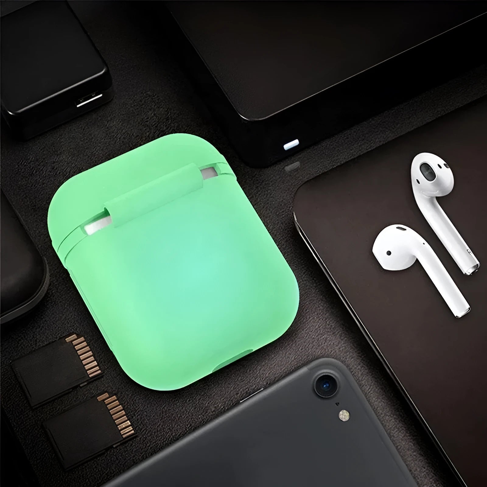 Luminous silicone protective case for Apple AirPods with flip-top design glowing in dark