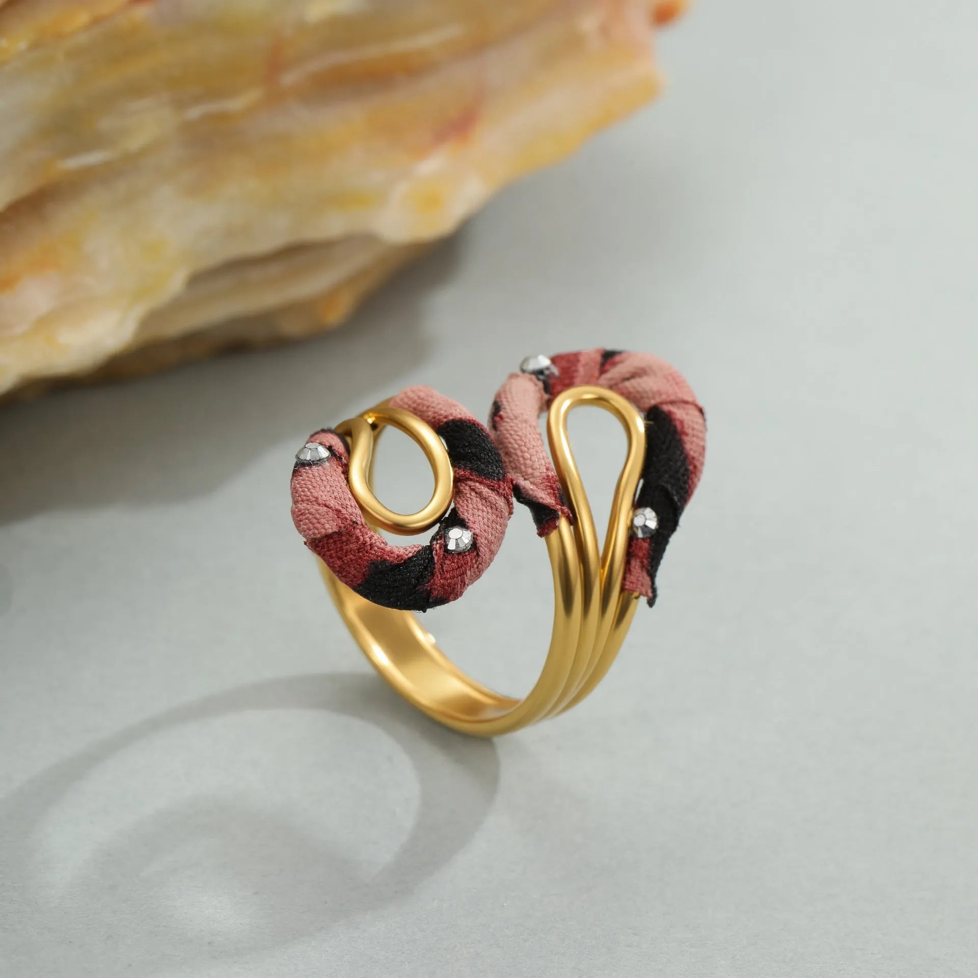 Geometric stainless steel open mouth ring with leopard print patterns in heart and star shapes