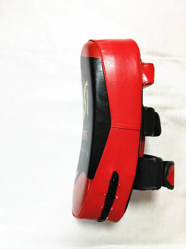 Black with red edges square martial arts hand target pad with a buckle strap.