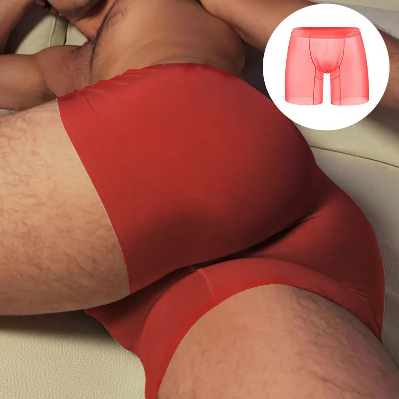 Men's orange seamless nylon sports boxer shorts with a low waist and body-shaping design.