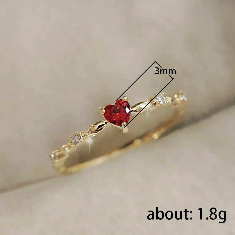 Gold or silver electroplated copper ring with a peach heart shape set with zircon stones.
