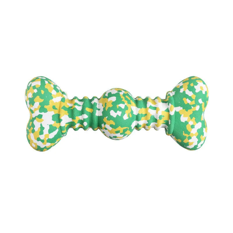 Green and white camouflage pattern natural rubber bone chew toy for large dogs on a wooden floor.