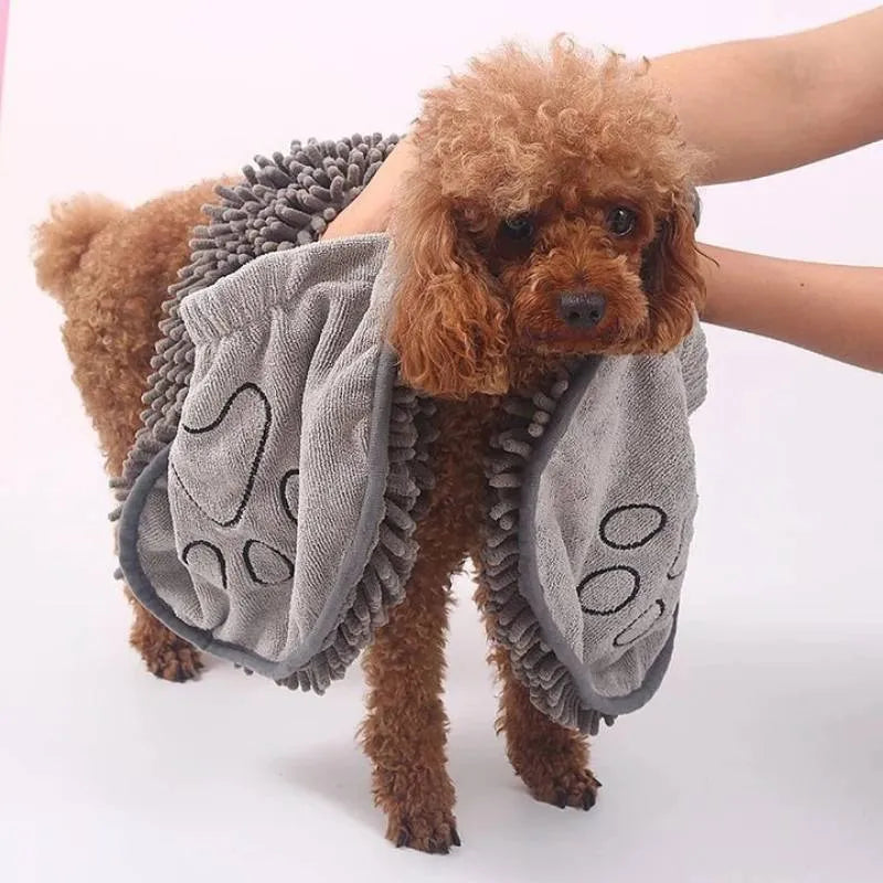 Blue pet bath robe towel for drying a dog after a wash, showing its size and soft texture.
