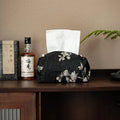 White Chinese brocade tissue box cover with embroidered plum design and optional pearl buckle.