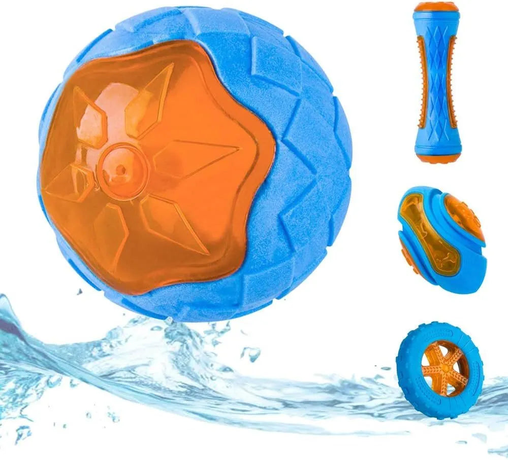 Set of three floating TPR dog toys: a blue ball, an orange barbell, and green tyres on a pool edge.