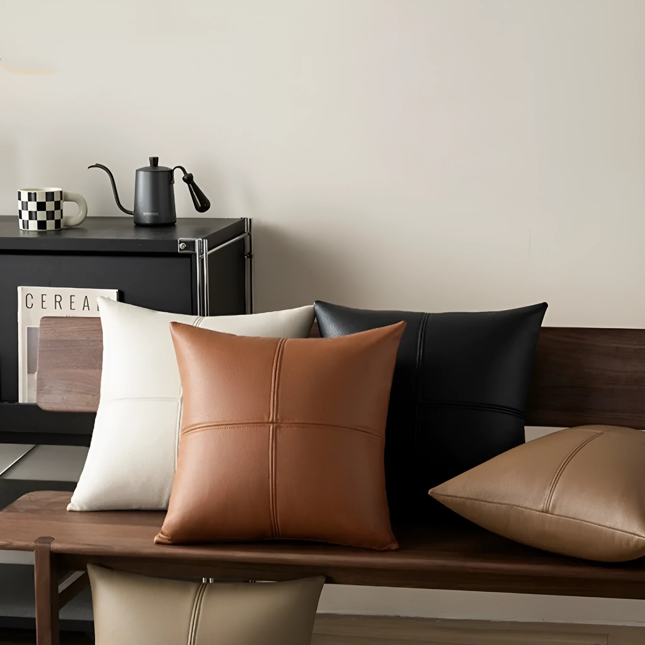 Solid colour soft cowhide leather pillow cover in Nordic style on a grey sofa.