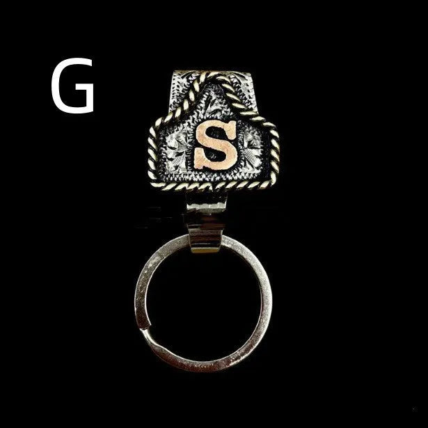 Handmade metal cow tag belt key holder with personalised alphabet letter