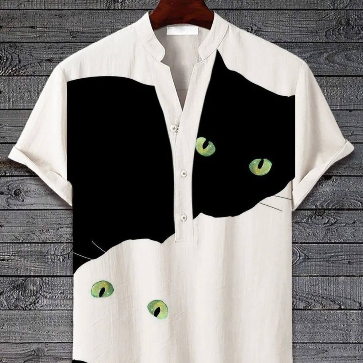 Man wearing a short sleeve shirt with a colourful 3D digital animal print design on the front.