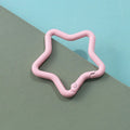 Zinc alloy five-pointed star keychain in light pink colour on a white background.