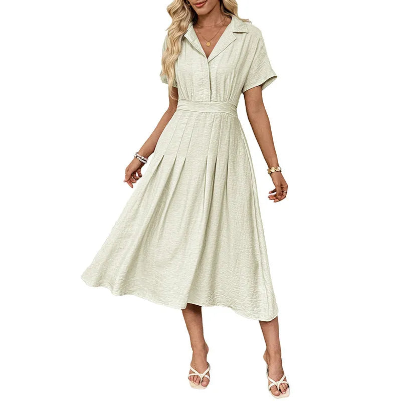 Light green women's shirt dress with lapel collar, waist-tight skirt, and pockets