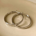 Gold and silver 40mm metal circle earrings with electroplated copper construction