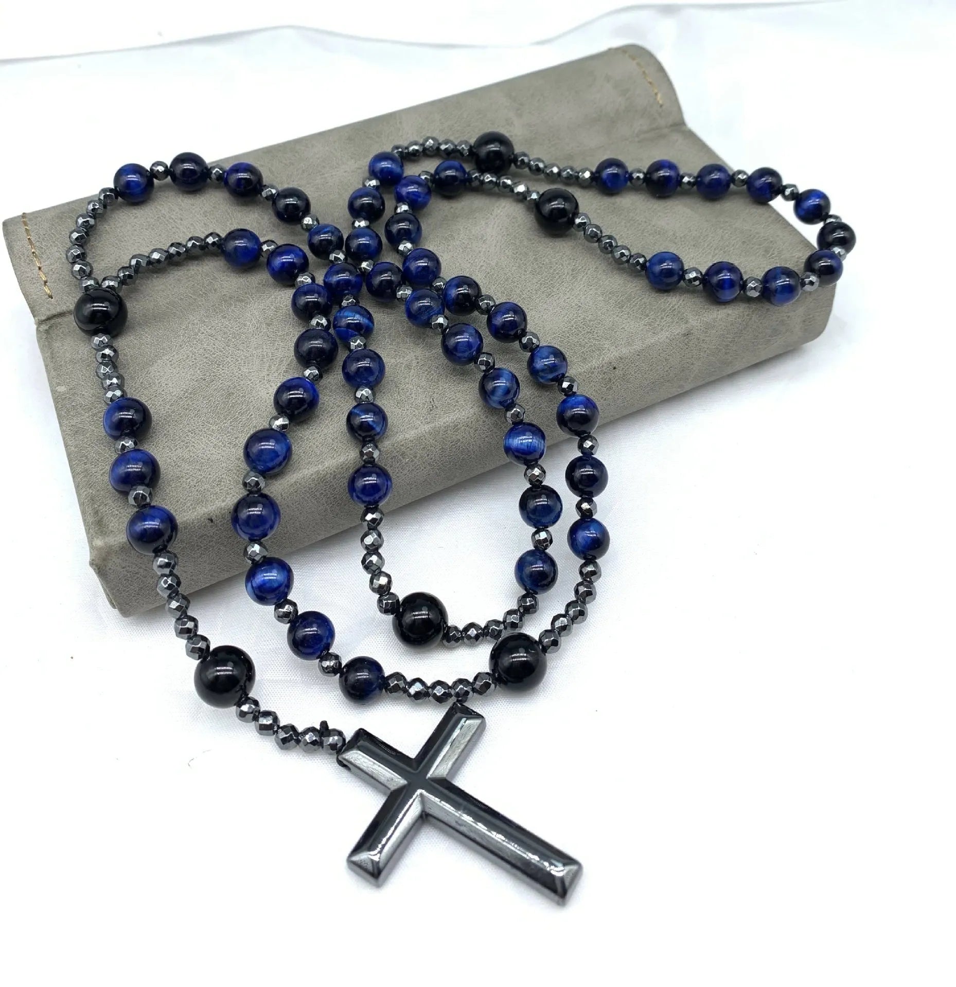 Men's stone geometric cross pendant on an 80cm ball bead chain with safety lock.