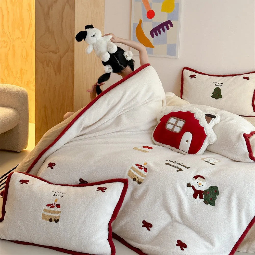 Cartoon winter Christmas bedding four-piece set with Xuefu Milk Pastry pattern, showing duvet cover, sheet, and pillowcases made from polyester.