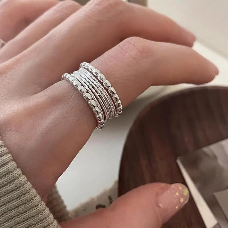 Copper alloy adjustable ring with geometric woven multilayer design